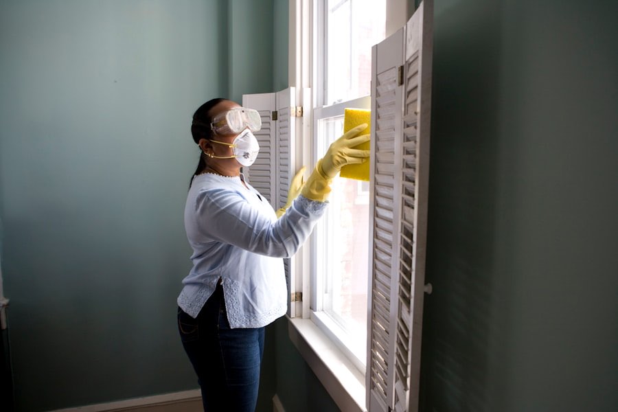 Professional cleaner preparing equipment in a bright room